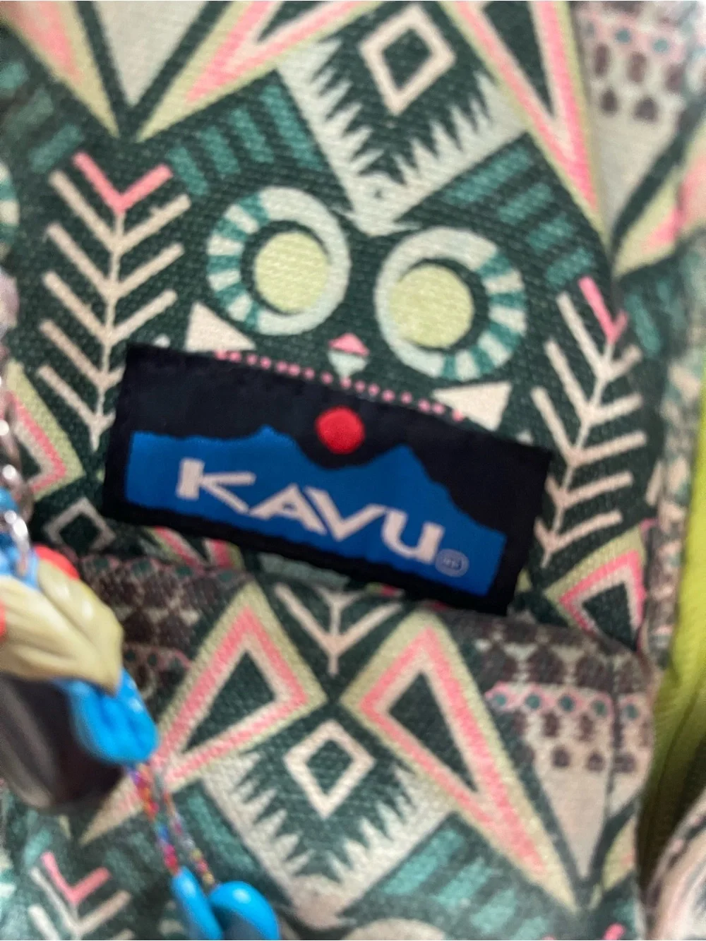 print KAVU Rope Bag featuring lime-green zippers and an owl motif accent.